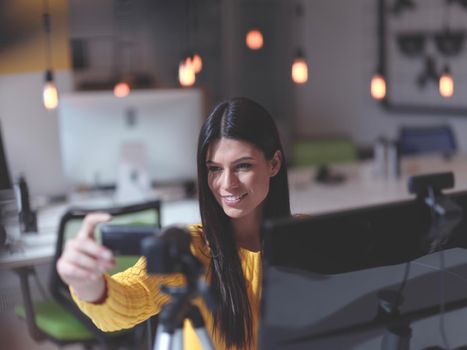 business woman have online meeting in modern open space coworking office as influencer making podcat or tutorial videos