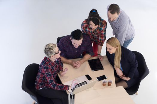 top view of multi ethnic startup business people group on brainstorming meeting in modern bright office interior