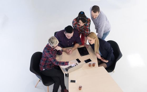 top view of multi ethnic startup business people group on brainstorming meeting in modern bright office interior