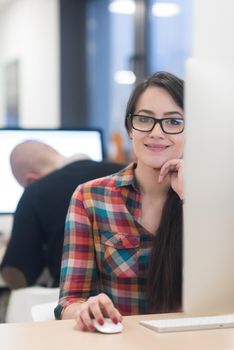 startup business, woman  working on dektop  computer at creative modern office relaxing and have fun