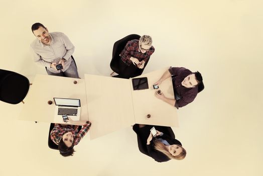 top view of multi ethnic startup business people group on brainstorming meeting in modern bright office interior