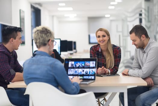 startup business team on meeting in modern bright office interior brainstorming, working on laptop and tablet computer