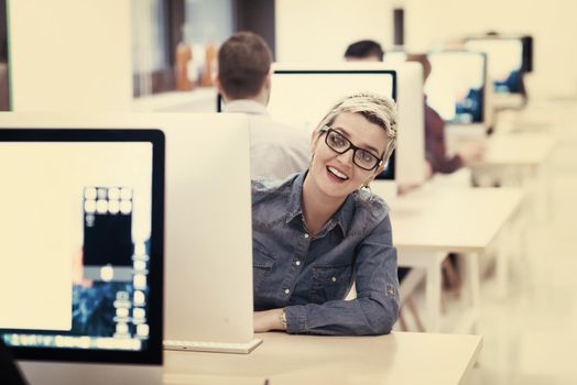 startup business, woman  working on dektop  computer at creative modern office relaxing and have fun