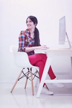 startup business, woman  working on dektop  computer at creative modern office relaxing and have fun