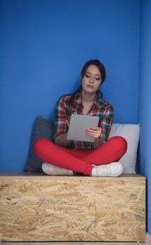 young woman in crative box working on tablet computer, startup business modern office room  interior