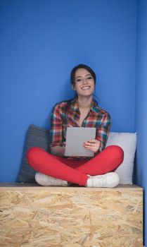 young woman in crative box working on tablet computer, startup business modern office room  interior
