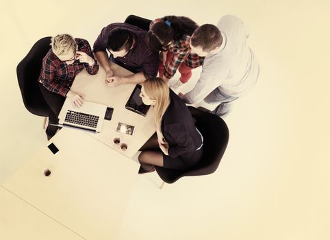 top view of multi ethnic startup business people group on brainstorming meeting in modern bright office interior