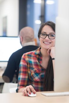 startup business, woman  working on dektop  computer at creative modern office relaxing and have fun