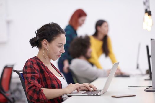 casual business woman at work  in creative modern coworking startup open space office