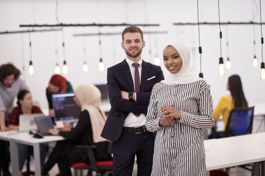 multiethnic startup business people team portrait at modern coworking office space employees working in background