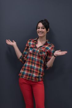 portrait of young startup business woman at modern office, grey chalkboard wall in background