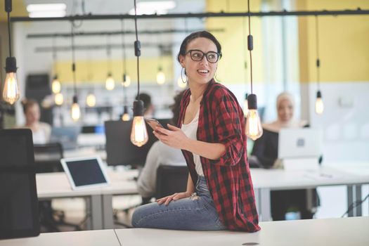 casual business woman at work  in creative modern coworking startup open space office