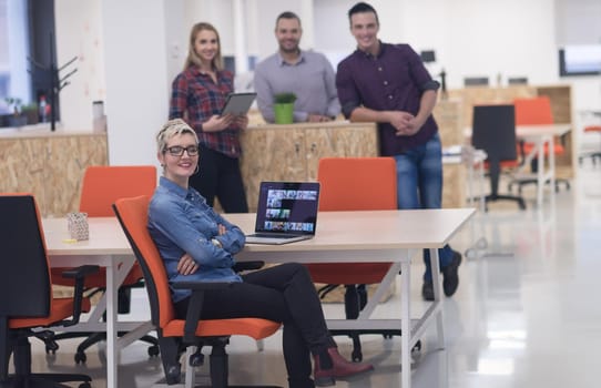 portrait of creative business people group in modern startup office interior