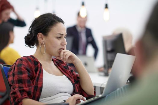 casual business woman at work  in creative modern coworking startup open space office