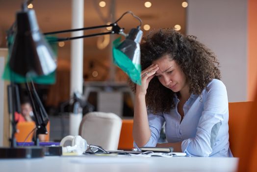 happy young  business woman with curly hairstyle in the modern office