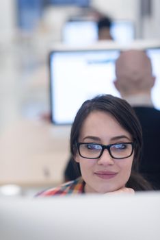 startup business, woman  working on dektop  computer at creative modern office relaxing and have fun