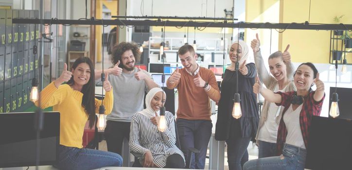 business team celebrating and have fun at modern coworking open space office