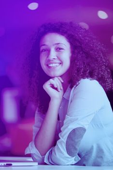 happy young  business woman with curly hairstyle in the modern office