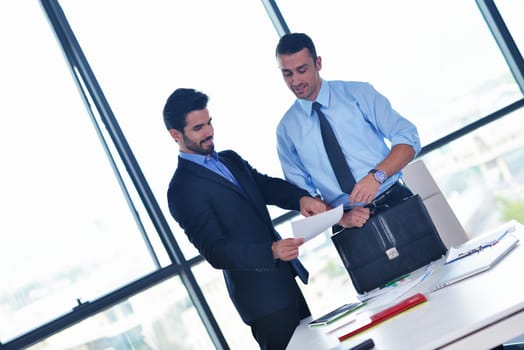 Group of happy young  business people in a meeting at office