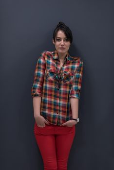 portrait of young startup business woman at modern office, grey chalkboard wall in background