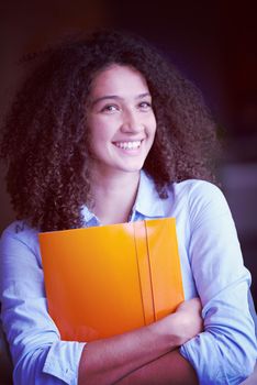 happy young  business woman with curly hairstyle in the modern office