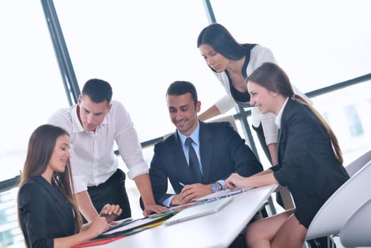 Group of happy young  business people in a meeting at office