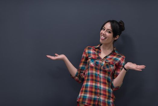 portrait of young startup business woman at modern office, grey chalkboard wall in background