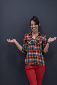 portrait of young startup business woman at modern office, grey chalkboard wall in background