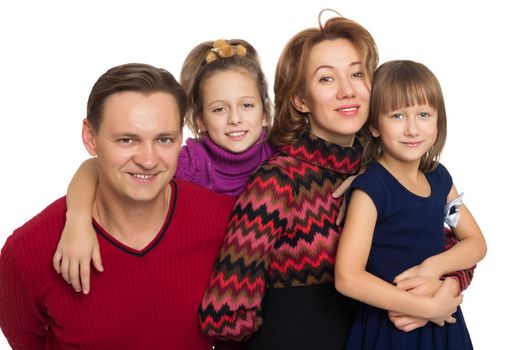 Happy family of four. Parents with their wonderful girls - Isolated on white background