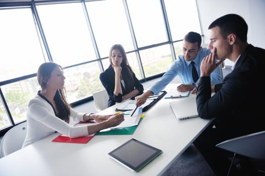 Group of happy young  business people in a meeting at office