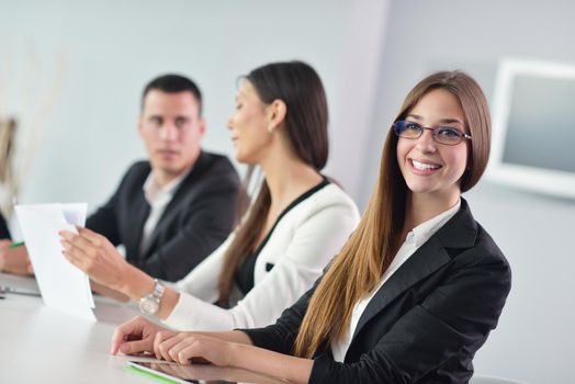 Group of happy young  business people in a meeting at office