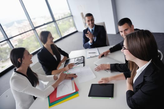 Group of happy young  business people in a meeting at office