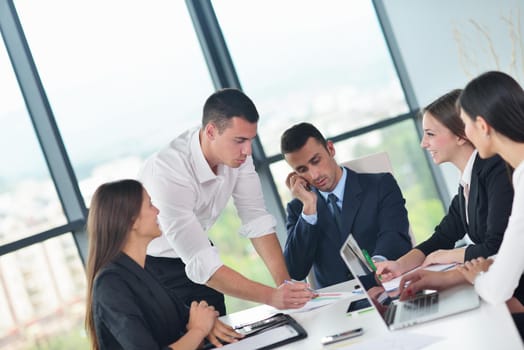 Group of happy young  business people in a meeting at office