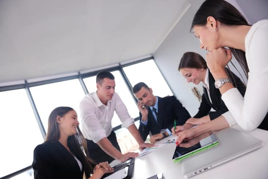 Group of happy young  business people in a meeting at office