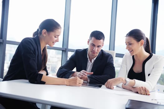 Group of happy young  business people in a meeting at office