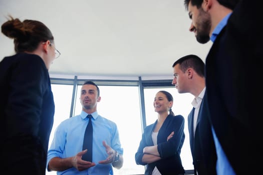 Group of happy young  business people in a meeting at office