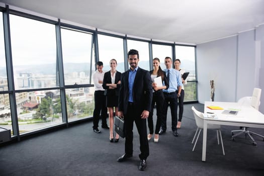 Group of happy young  business people in a meeting at office