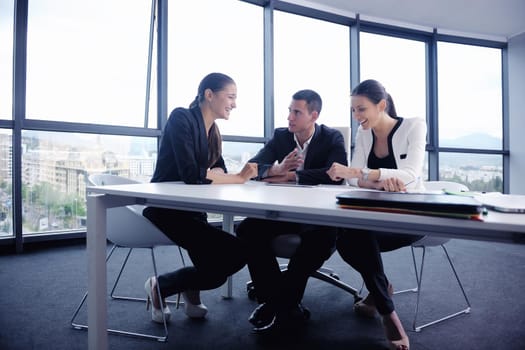 Group of happy young  business people in a meeting at office