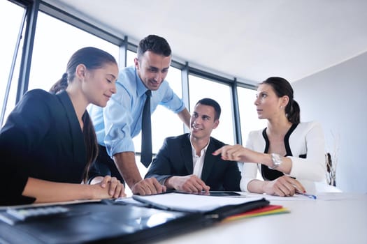 Group of happy young  business people in a meeting at office