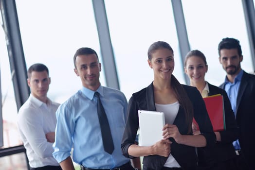 Group of happy young  business people in a meeting at office