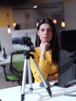 business woman have online meeting  in modern open space coworking office as influencer making podcat or tutorial videos