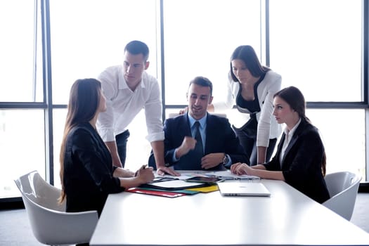 Group of happy young  business people in a meeting at office