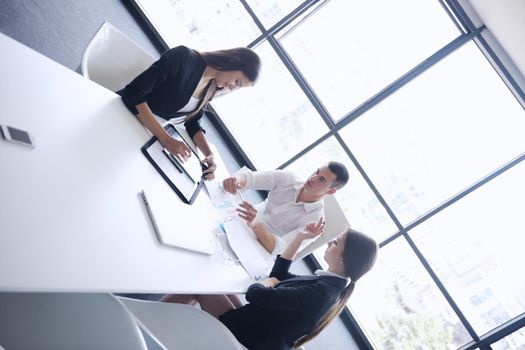 Group of happy young  business people in a meeting at office