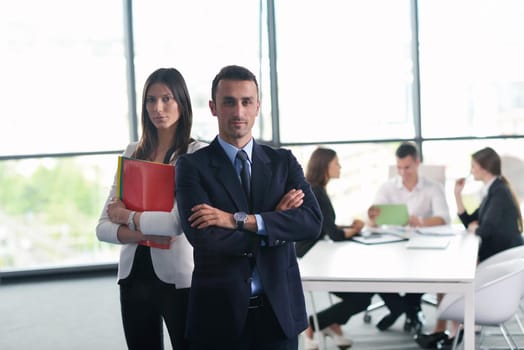 Group of happy young  business people in a meeting at office