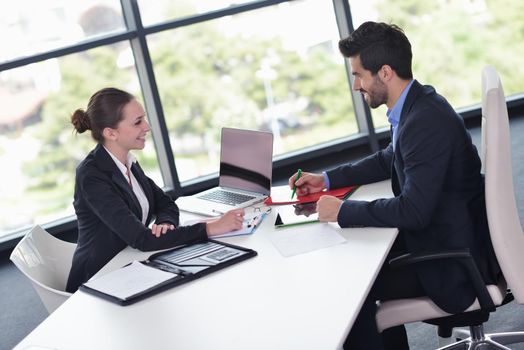 Group of happy young  business people in a meeting at office