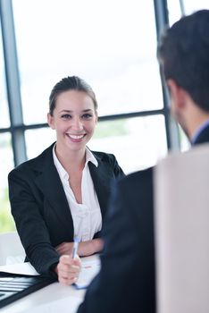 Group of happy young  business people in a meeting at office