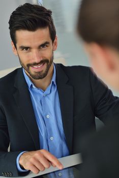 Group of happy young  business people in a meeting at office