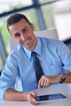 close-up of human hand  business man using tablet compuer at office