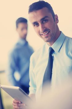 close-up of human hand  business man using tablet compuer at office