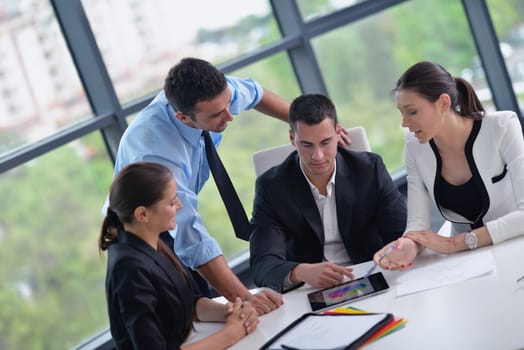 Group of happy young  business people in a meeting at office